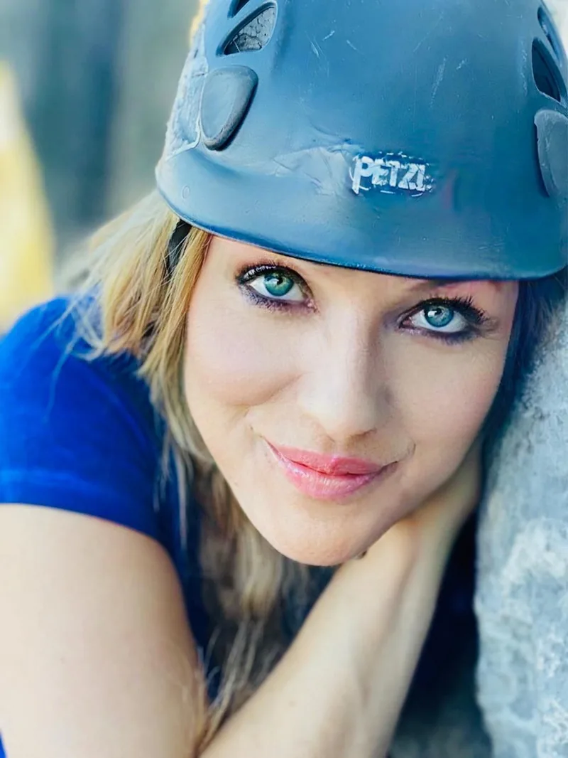 Kat Heldman close-up portrait with climbing helmet