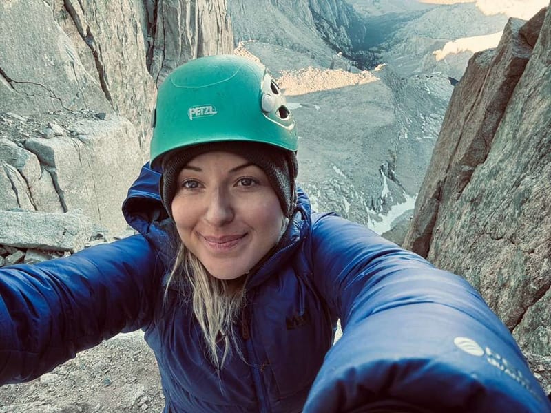 Kat Heldman selfie on a rock face